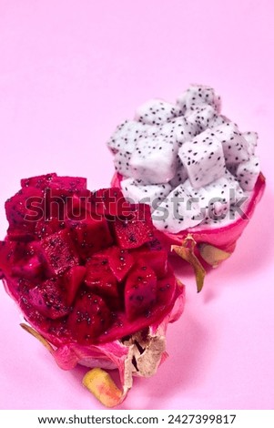 Red dragon fruit Set with appetizing serving on pink background. Top view