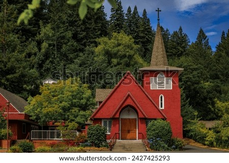 Restored red facade of Saint Philip the Apostle, Roman Catholic Church in Occidental, rural Northern California Royalty-Free Stock Photo #2427425293
