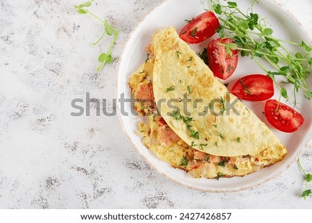 Healthy breakfast. Quesadilla with omelette, salmon  and sliced tomatoes. Keto, ketogenic lunch. Top view