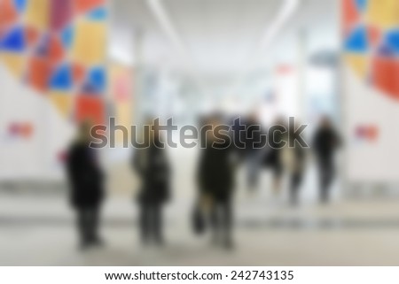 People walk. Intentionally blurred post production.