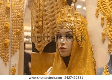 A picture of women's jewelry on a storefront at the Dubai Gold Souk.