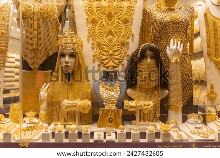 A picture of women's jewelry on a storefront at the Dubai Gold Souk.