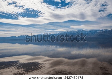 Lake Manly is a rare sight in Badwater Basin of Death Valley National Park because so little rain falls here.  Royalty-Free Stock Photo #2427450675