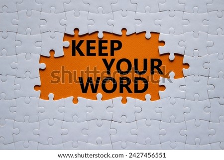 Keep your word symbol. Concept words Keep your word on white puzzle. Beautiful orange background. Business and Keep your word concept. Copy space.