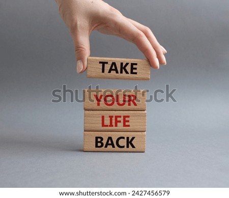 Take your life Back word symbol. Wooden blocks with words Take your life Back word. Psychologist hand. Beautiful grey background. Psychology and Take your life Back word. Copy space.