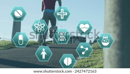 Image of medical icons over woman jogging in a park. Digital interface global sport and performance concept digitallygenerated image.