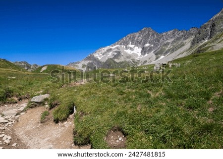 21.08.2016 Les Contamine-Montjoie, Haute-Savoie, France. Hikers heading back to Les Contamine on the Tour du Mont Blanc