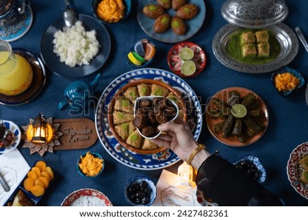 Ramadan Iftar Table. Muslim Family Having Dinner At Home. Iftar Table with Traditional Food. Fasting ends with Dates. Ramadan Feast Celebrations, Eid Mubarak Concept Uskudar Istanbul, Turkiye (Turkey) Royalty-Free Stock Photo #2427482361