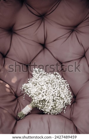Details of the wedding morning. Wedding bouquet. Bride's bouquet of small white gypsophila flowers selective focus