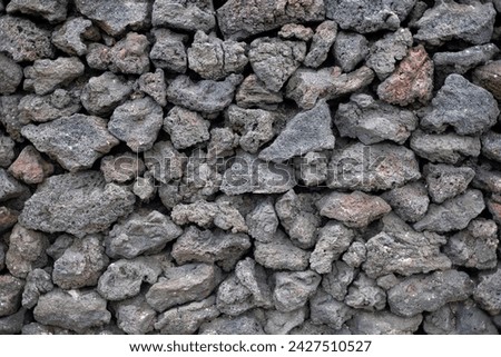 Natural background image formed by rough basalt rocks Royalty-Free Stock Photo #2427510527