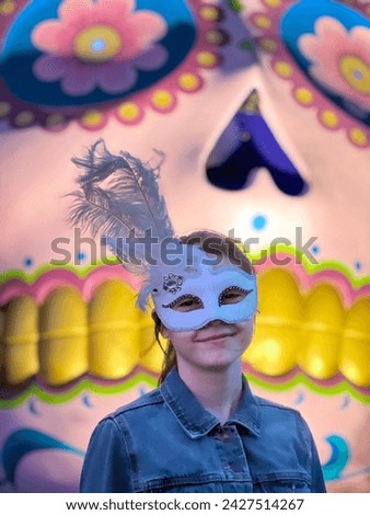 Beautiful teen age girl (female age 14) wearing a Venetian mask on carnival party.