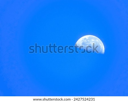 APPROACH TO THE MOON IN FULL DAYLIGHT WITH A BLUE AND CLEAR SKY