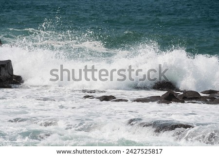 Waves break on the rocks

