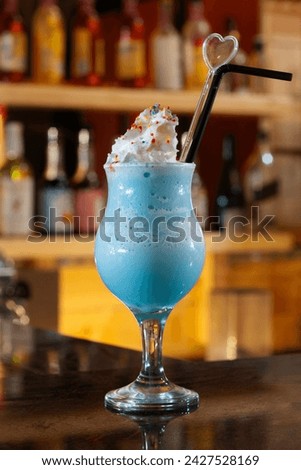 Iced Blue Bubble Gum Frappe is a cold drink made from Sugar Gum mixed with whipped cream and coconut water Royalty-Free Stock Photo #2427528169