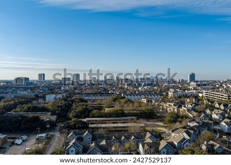 Aerial view of the Houston Texas Downtown cityscape with tall skyscrapers in early morning during winter.