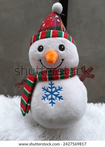 Cute snowman doll photo. suitable for birthdays and Christmas events