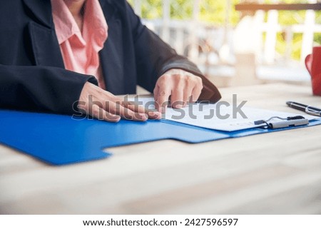 Close up businesswoman hands manager signing reading business contract document. Businesspeople hand use pen signing contract start up small projects in conference room. Business agreement concepts