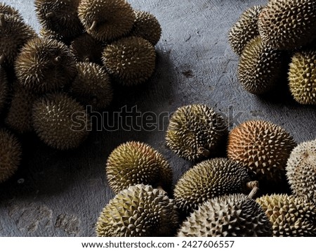 Group of fresh durians in the durian market Royalty-Free Stock Photo #2427606557