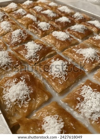 Baklava (Баклава), is a delicate pastry served in numerous countries such as Russia, Turkey, and throughout the Balkans, the Middle East, the Caucuses. Royalty-Free Stock Photo #2427618049