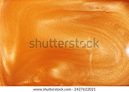 Golden shimmer liquid, luxurious background, shimmering texture, cosmetic art Royalty-Free Stock Photo #2427622021