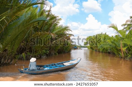 Tonle Sap lake, Siem reap Province, Cambodia. Fisherman in his boat, Floating village of Kompong Phluk, Cambodia.