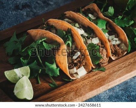 Buffalo tacos with fresh parsley and lime