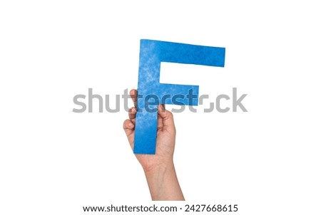 closeup hand holding paper letter F isolated on white