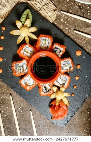A vibrant sushi platter filled with an assortment of fresh and colorful sushi rolls, including tuna, salmon, shrimp, and California rolls.
