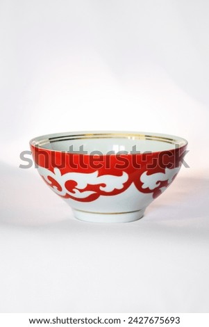 Kazakh piala. Central Asia traditional tea cup with national ornament. National red bowl isolated on white background Royalty-Free Stock Photo #2427675693