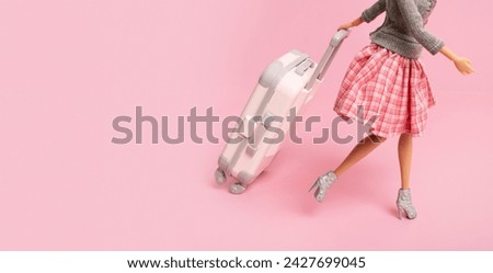 Banner with doll with a suitcase and copy space. Travel, vacation creative minimalistic concept.