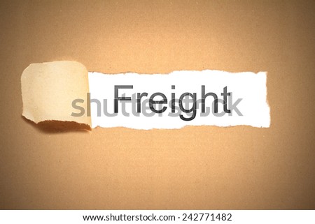 brown packaging paper torn to reveal freight