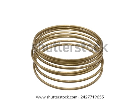 The old bangle jewelry made from brass  isolated on white background,macro  photo,has path Royalty-Free Stock Photo #2427719655