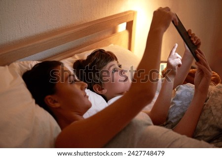 Mom, boy and tablet in bedroom at night for care, bonding and watch movies together in family house. Mother, child and home on digital touchscreen for cartoon, film and streaming subscription in bed