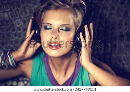 Relax, listening to music and woman with headphones, streaming radio on wall background. Person, dj and girl with headset, hip hop and entertainment with song and audio track with sound and podcast