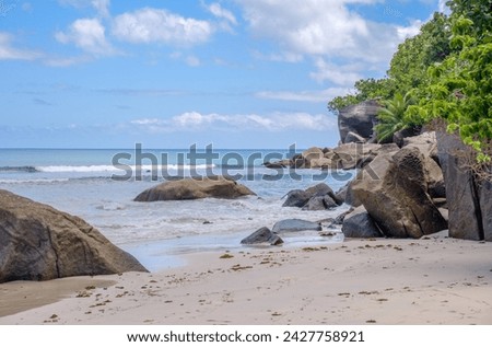 big boulders on the empty beach on Mahe in the morning, Seychelles