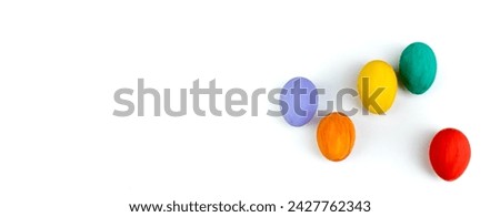 Happy Easter card. Colorful shiny easter eggs on isolated white background. Copy space for text, Banner Royalty-Free Stock Photo #2427762343