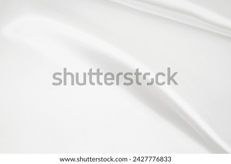 White silk background with blank space.