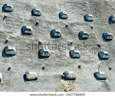 an abstract image of stones on a cement wall