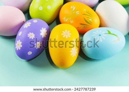 colorful pastel Easter eggs on green background copy space stock photo