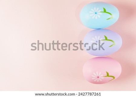 Colorful pastel Easter eggs on pink background copy space stock photo