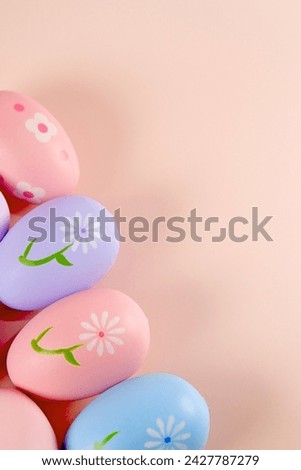 Colorful pastel Easter eggs on pink background copy space stock photo
