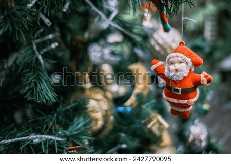 Santa Claus doll hanging on the Christmas tree