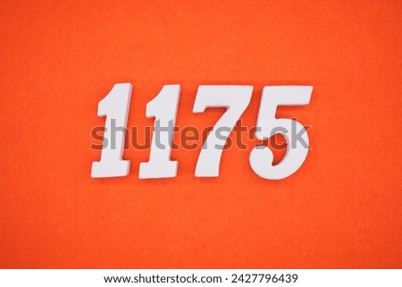 Orange felt is the background. The numbers 1175 are made from white painted wood.