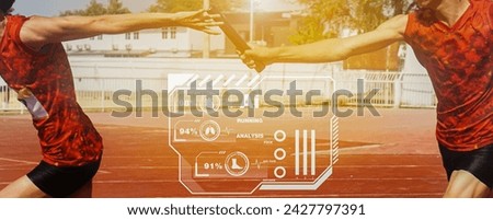 Sprint athletes use AI tools to analyze their running.Professional Athlete passing a baton to the partner against race on racetrack.selective focus.