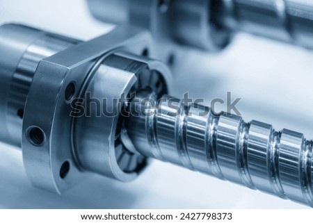 Closeup scene the spare parts  lead ball screw set in the light blue scene. The hi-precision CNC machine part manufacturing concept. Royalty-Free Stock Photo #2427798373