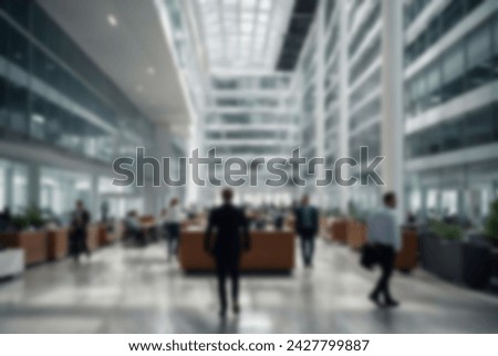 Blurred background of Business people at work in a busy luxury office space