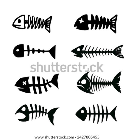 Set of silhouettes of dead fish and fish bones
