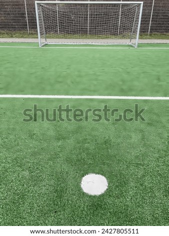 penalty spot in front of a soccer goal