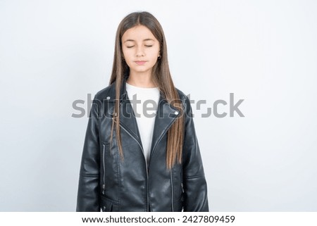 Young beautiful teen girl wearing biker jacket nice-looking sweet charming cute attractive lovely winsome sweet peaceful closed eyes