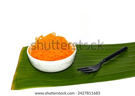 Sweet and delicious with dessert Thailand Foi Thong Dessert put on banana leaf on white background,isolated picture.